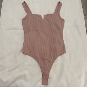 Pink body suit